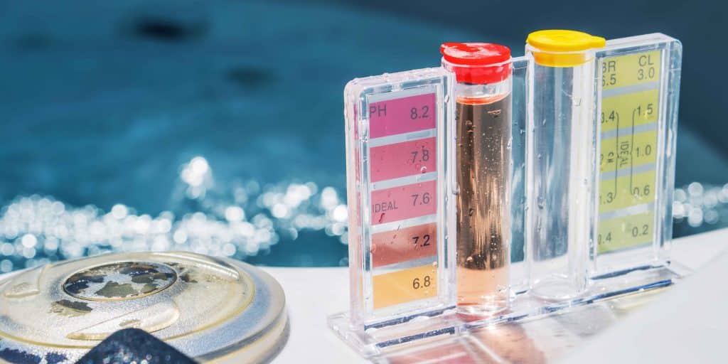 Professional pool water testing kit showing pH and chlorine levels by PureWave Pools in Santa Cruz